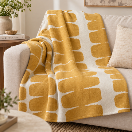 Mustard and lvory Geometric knit Throw.